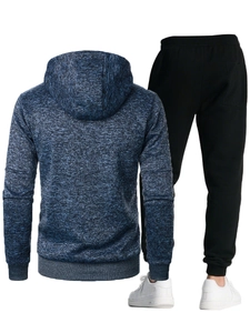 Rear detail of blue knit hoodie and black joggers set with ribbed cuffs and pocket