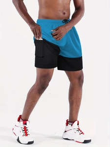 Detail of blue 2-in-1 running shorts showing a built-in phone pocket and compression liner
