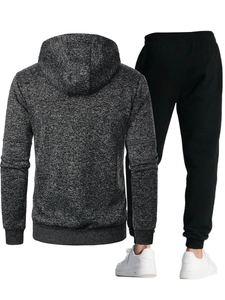 Back view of men's gray hooded sweatshirt and black drawstring joggers tracksuit set