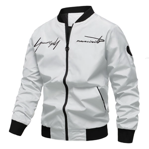Detail of white bomber jacket showing black ribbed collar and script embroidery on chest