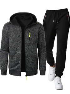 Detail of hoodie with neon green zipper pulls and knit jacquard fabric texture