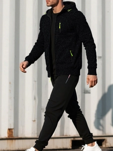 Detailed texture of men's black hooded jacket with neon green zipper and drawstring
