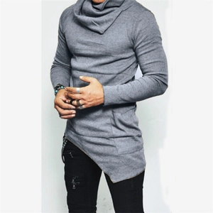 Detail of the high cowl neck and asymmetric hemline on this gray long sleeve knit top
