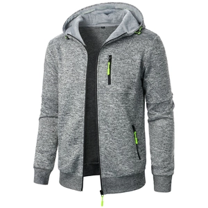 Detailed macro of men's gray hooded jacket featuring neon green zipper accents and drawstring