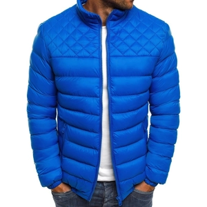 Close-up of royal blue quilted jacket featuring stand collar and metal zipper detail
