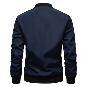 Rear view of navy blue bomber jacket with black ribbed cuffs and high-quality fabric