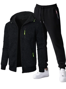 Detailed close-up of charcoal gray hooded zip-up jacket and black tapered joggers