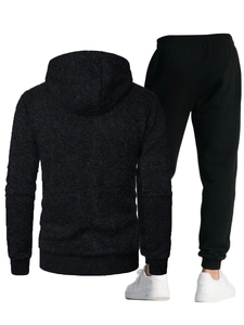 Detail of men's hooded jacket with jacquard texture and athletic knit jogger pants