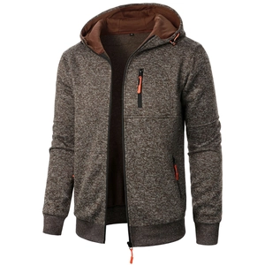Detail of hooded sports jacket with fleece lining and orange drawstring accents