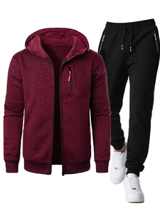 Close-up of burgundy waffle knit hoodie texture and black joggers with ribbon detail