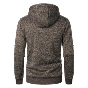 Detail view of men's knitted hoodie back showing jacquard texture and ribbed hem