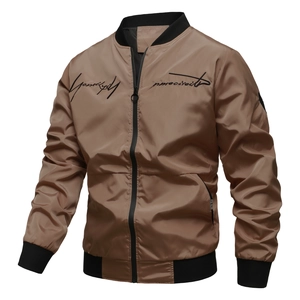Detail of brown bomber jacket with black ribbed collar and cursive chest embroidery