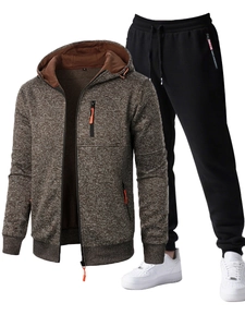 Detail of men's heather brown zip-up hoodie with orange accents and black jogger set