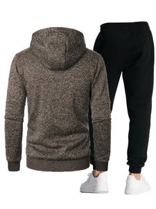 Detail view of the back of a men's hooded tracksuit showing marled grey knit texture