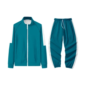 Survêtement enfant turquoise avec veste à col montant zippée et pantalon rayé