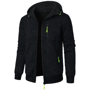 Detail of grey knitted hoodie with neon green accents and textured zipper pocket