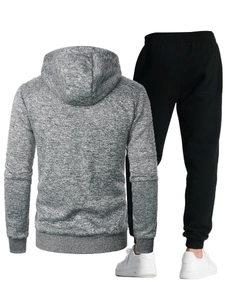 Rear view of men's grey hooded sweatshirt and black joggers athletic tracksuit set