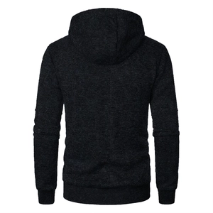 Detail view of the back of a men's hooded jacket with dark grey jacquard knit texture