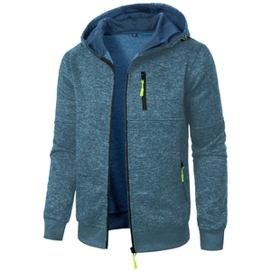 Detailed macro view of dark blue textured hoodie with vibrant neon green zipper pulls