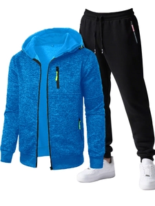 Detail of blue textured hooded zip jacket with neon accents and black joggers