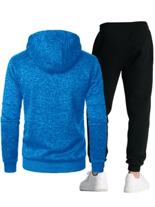 Rear view of men's blue textured hooded sweatshirt and black tapered jogger pants