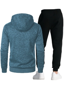 Detail view of heathered blue hooded sweatshirt and black slim joggers back design