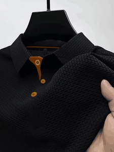 Men's mesh ice silk polo shirt in black with orange button accents and waffle texture