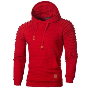 Detail of dark red quilted hoodie with shoulder pleats and brown leather brand label