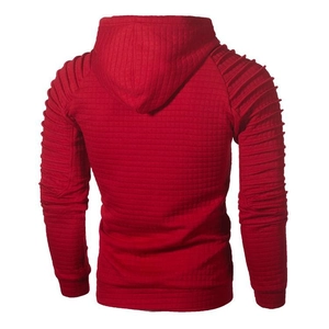 Back view of red quilted hoodie with textured grid pattern and ribbed shoulder details