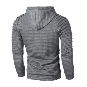 Detail of grey men's hoodie showing waffle texture and quilted shoulder stitching