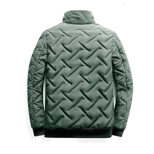 Detail view of men's puffer jacket featuring quilted diamond pattern and ribbed cuffs