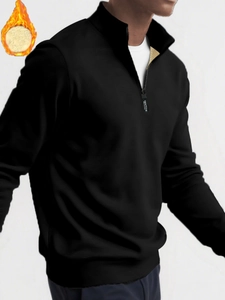 Detail of men's black quarter-zip sweatshirt with warm beige fleece lining and ribbed cuffs
