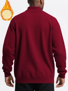 Rear view of a burgundy fleece-lined sweatshirt showing warmth and ribbed cuffs detail