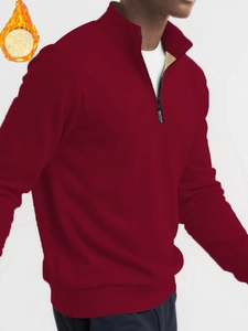 Detail view of burgundy fleece sweatshirt featuring a functional zipper and warm lining