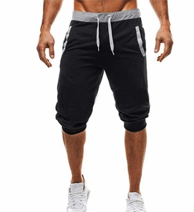 Detailed shot of men's slim fit sports shorts with grey contrast drawstring waist