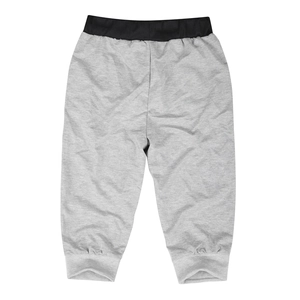Detail view of men's slim fit jogging pants with elastic waistband and ribbed cuffs