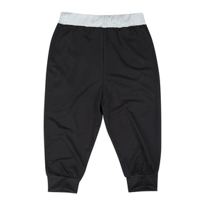 Detail of slim-fit jogger pants featuring grey elastic waistband and black knit fabric