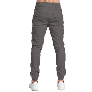 Rear view of slim fit dark grey cargo jogger trousers with elastic drawstring waist
