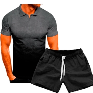 Detail of men's polo shirt with grey-black gradient and black drawstring shorts set