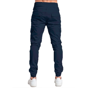 Rear view of men's slim fit navy cargo pants with elastic waist and flap pockets