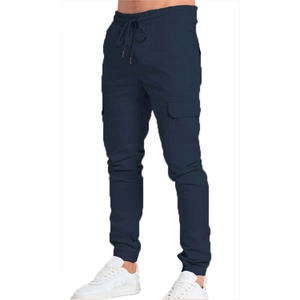 Detail showing elastic drawstring waist and side cargo pockets on navy blue joggers