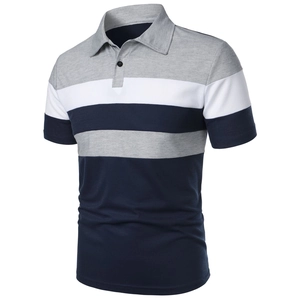 Close-up of three-color patchwork polo shirt with grey white and navy blue panels