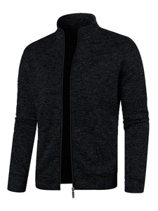 Detail of grey knitted sweater jacket with zipper closure and stand-up collar texture