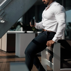 Close-up of slim fit white button shirt with stand collar and long sleeves for men