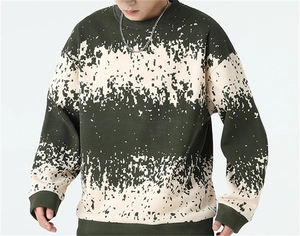 Close-up of dark green men's sweater featuring white digital pixelated stripe details