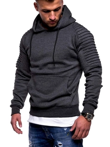 Detailed view of dark grey hoodie featuring ribbed raglan sleeves and a kangaroo pocket