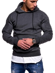 Detailed view of grey hoodie featuring textured pleated raglan sleeves and kangaroo pocket