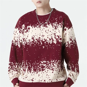 Men's loose burgundy knit sweater with cream pixelated pattern and silver chain detail