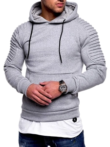 Detail view of men's grey hoodie featuring pleated raglan sleeves and a layered white hem
