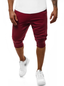 Dettaglio dei pantaloni sportivi bordeaux da uomo con polsini a costine e tessuto in cotone